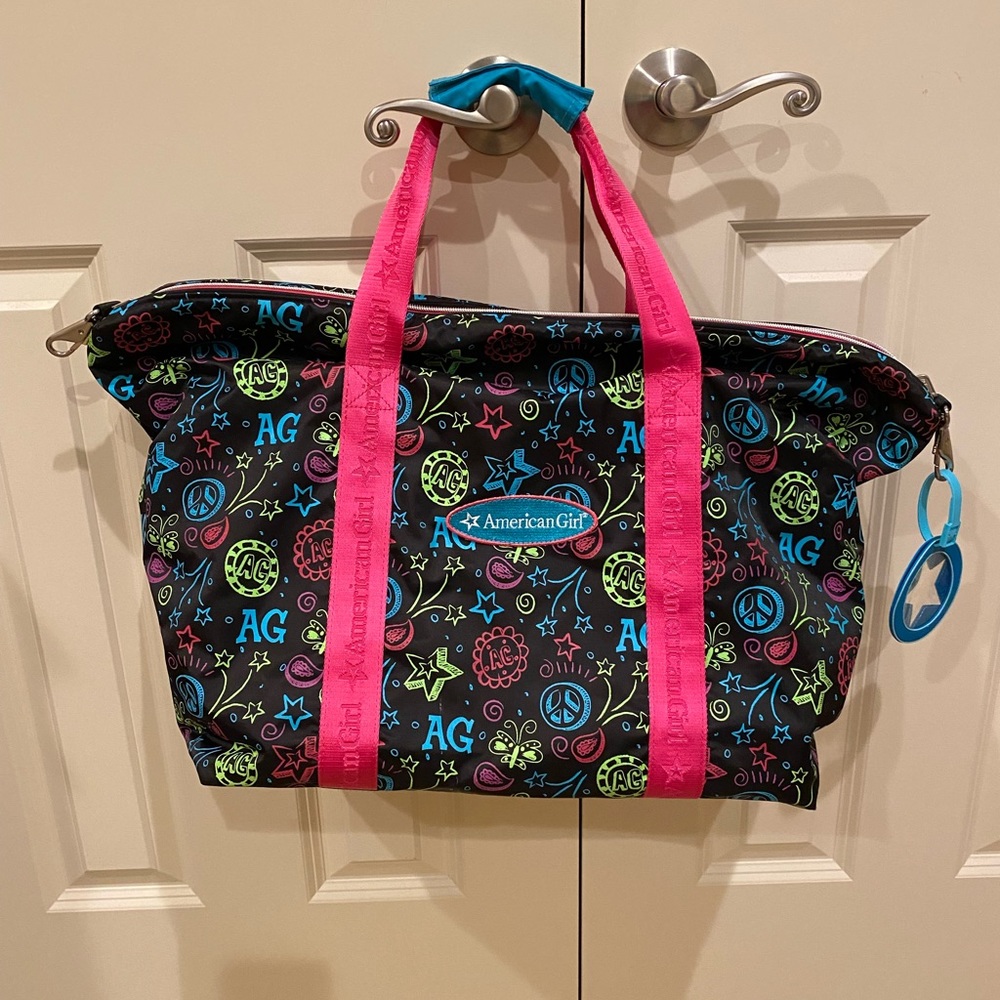 American Girl duffle bag with zipper enclosure.